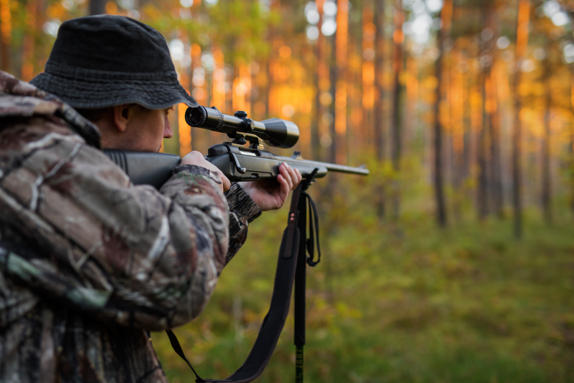 picture of man looking through optics