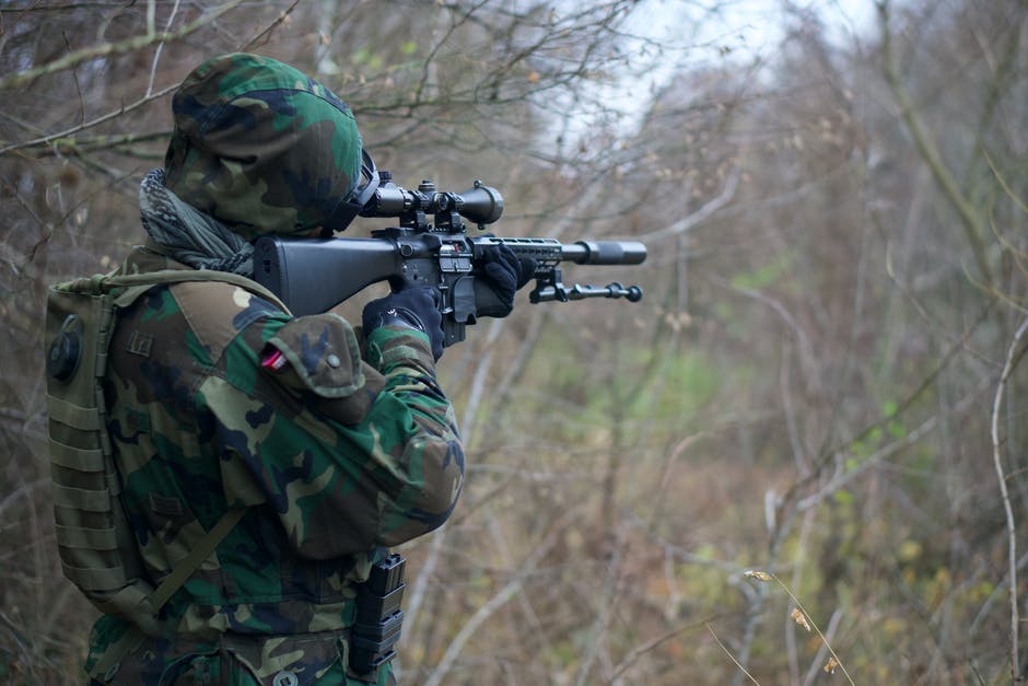 sniper looking through the scope