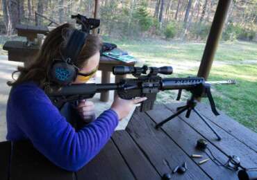 woman using an ar15 scope
