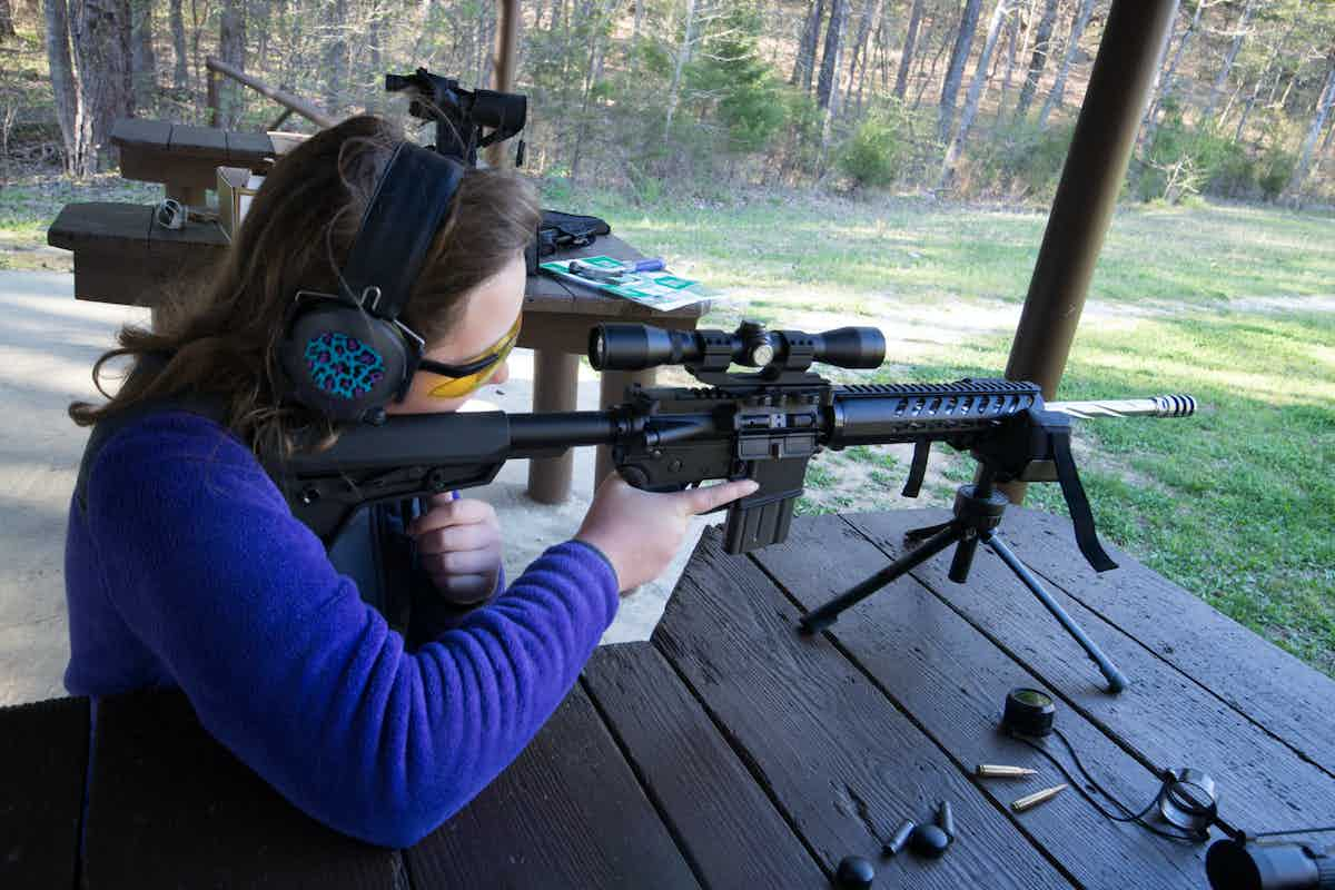 woman using an ar15 scope